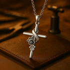 Silver paw and cross pendant necklace