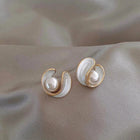 Luxurious earrings with white opal and pearl in gold