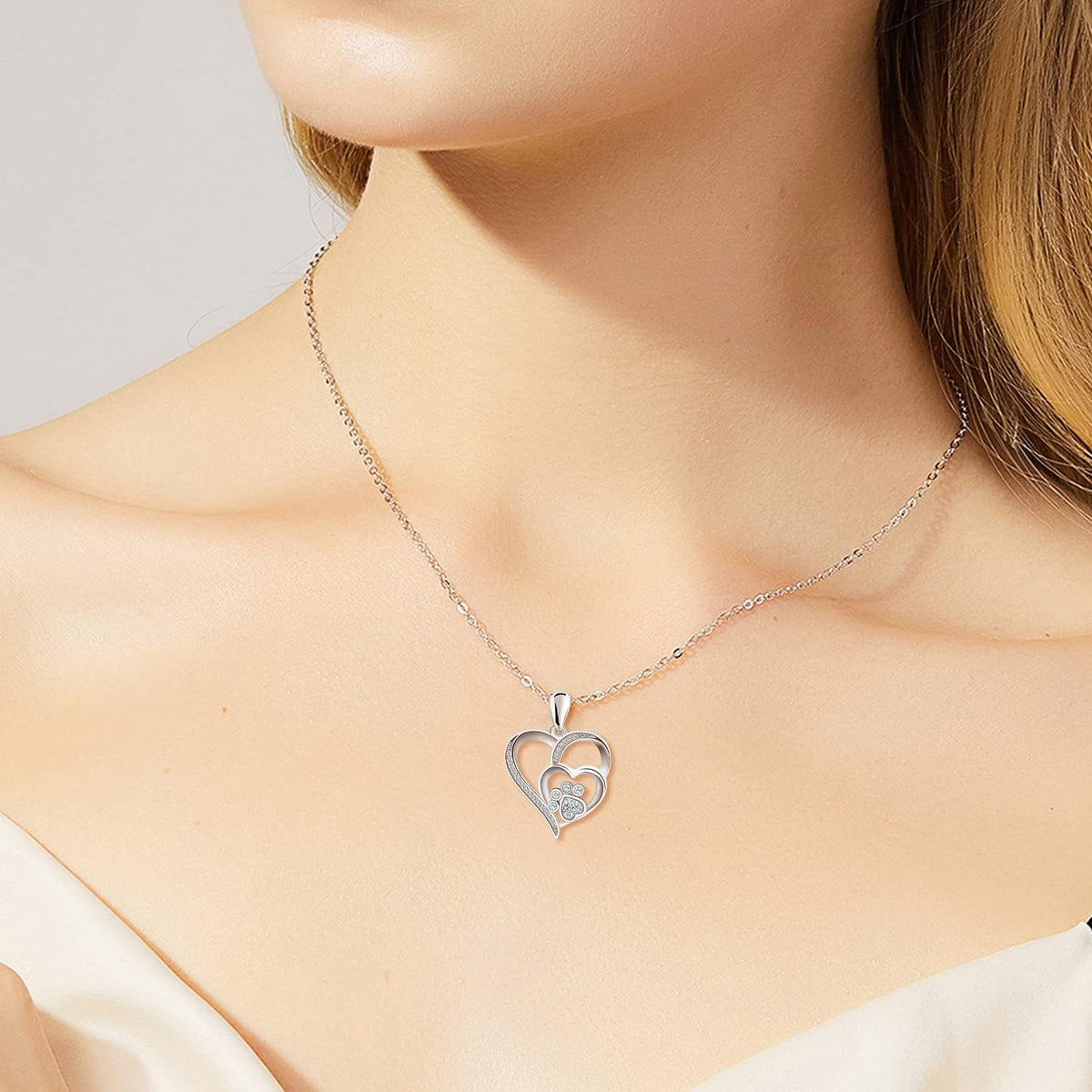Silver necklace with paw and heart with cubic zirconia