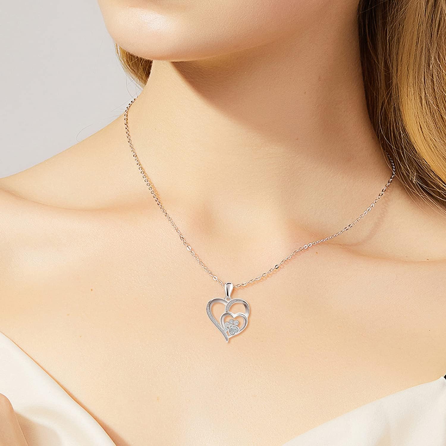 Silver necklace with paw and heart with cubic zirconia