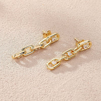 Elegant zirconia chain earrings in gold