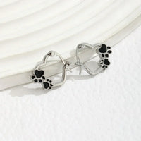 Huggie earrings with heart and black enamel