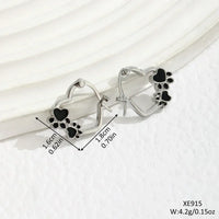 Huggie earrings with heart and black enamel
