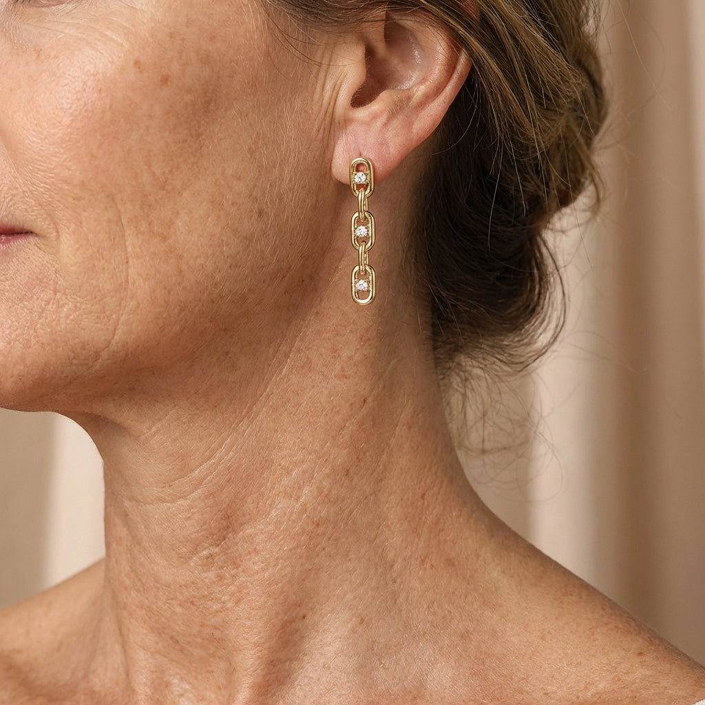 Elegant zirconia chain earrings in gold