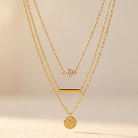 Gold Tone Layered Necklace With Round Pendant